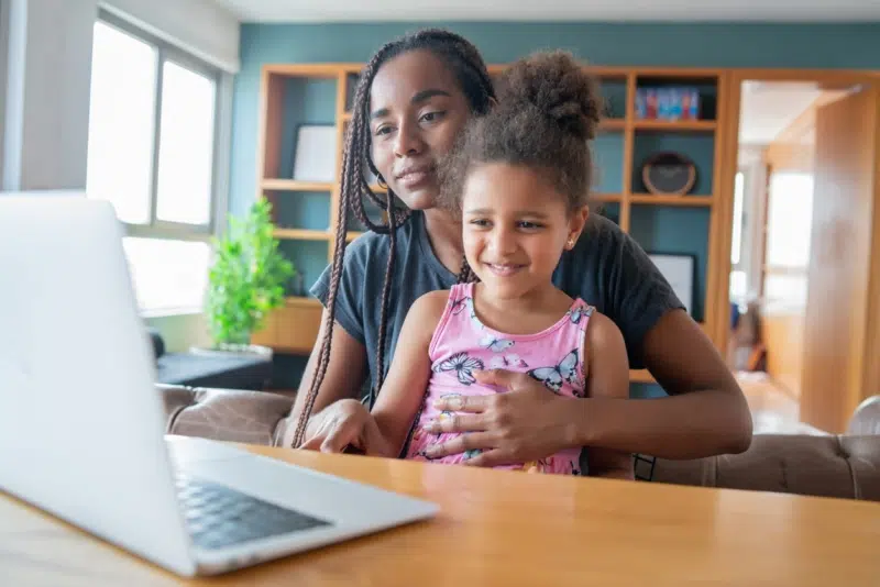 Woman and her child having an online meeting with AllerVie doctors