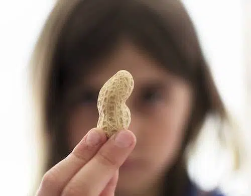 Girl holding peanut