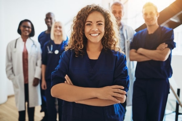 Doctors smiling while taking a group photo at AllerVie Health