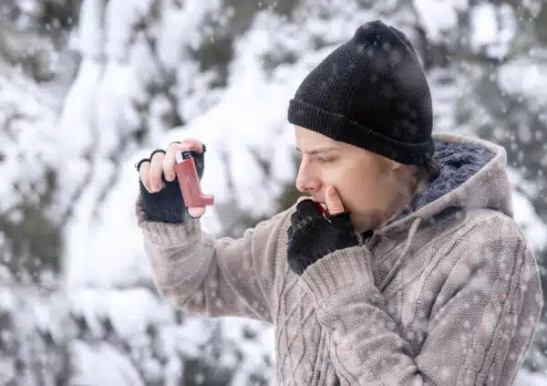 Breathless Man with asthma inhaler for relief an attack