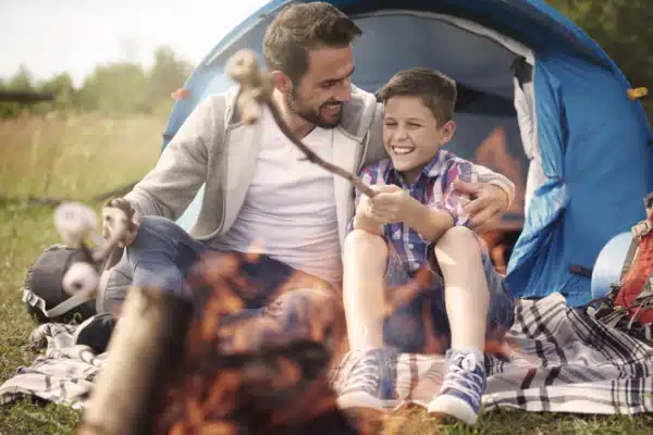 Father and his son outside camping and enjoying time together