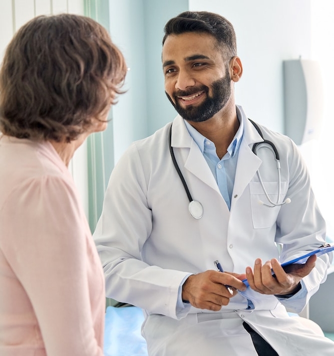 Doctor in a hospital evaluating if a female older patient is a candidate for biologic therapy for asthma treatment